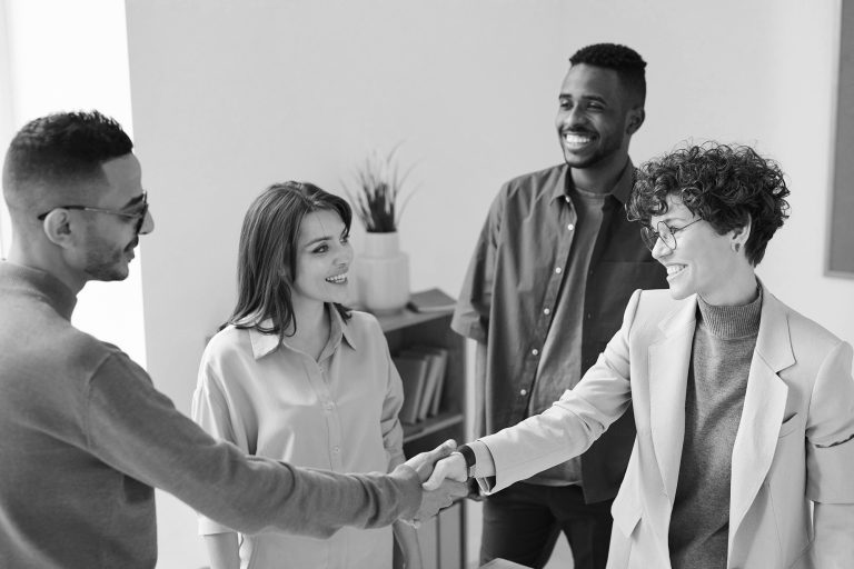 several people in a working environment - learn about building long-term freelance client relationships
