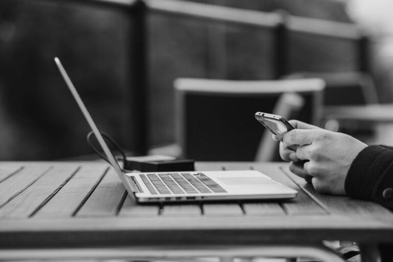Best VPN for Creators What You Actually Need and Why - person working with laptop and smartphone