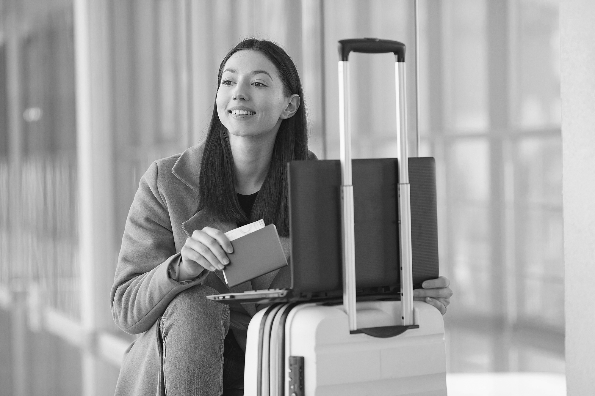 Best VPN for Creators Who Travel - What to Look For and Why - person with luggage and open laptop