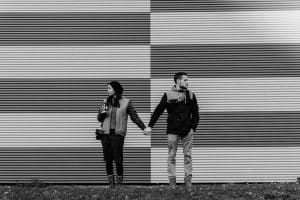 two people standing with each other, looking at opposite directions - learn about conflict and resolution in storytelling
