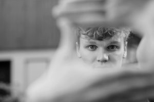 person creating a frame within a frame with his hands - learn more about framing as a composition technique
