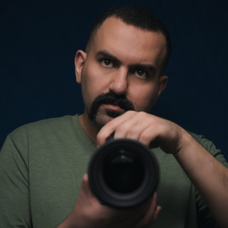 a self portrait of the owner of Hamed Media with a camera in hand