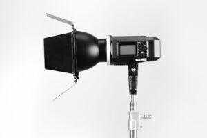How to Choose a Flash for Photography - A Complete Flash Buying Guide - a studio strobe on a stand