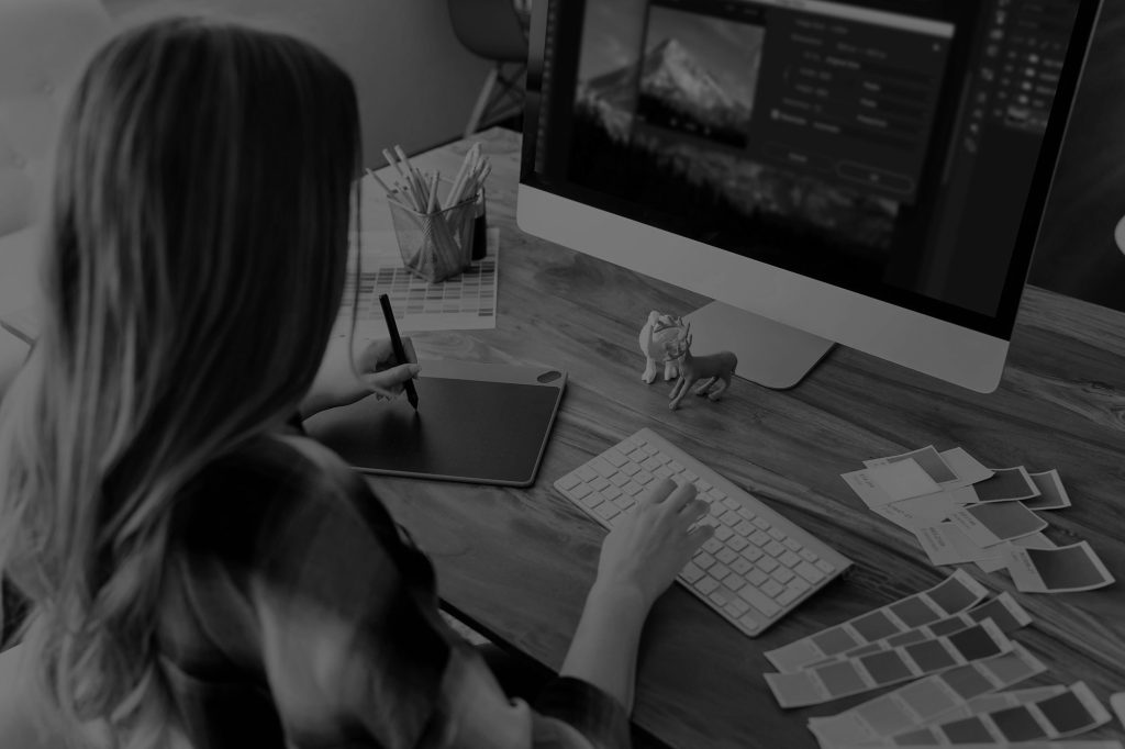 person editing on a computer - learn more about creating a consistent editing style