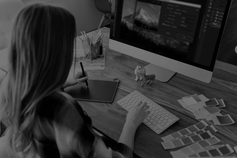 person editing on a computer - learn more about creating a consistent editing style