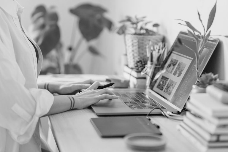 photo editing person on a laptop