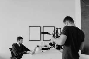 a person taking video of another - How to Get Better Results from Your Videographer (Even If You Hate Being on Camera)
