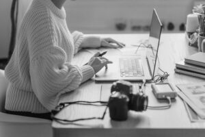 a person editing on a computer - raw format in photography and video