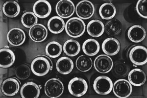 a collection of lenses - Should You Buy a New or Used Camera Lens - Budget vs. Premium Explained