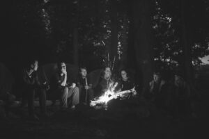 people gathered around a campfire - The Basics of Storytelling for Content Creators