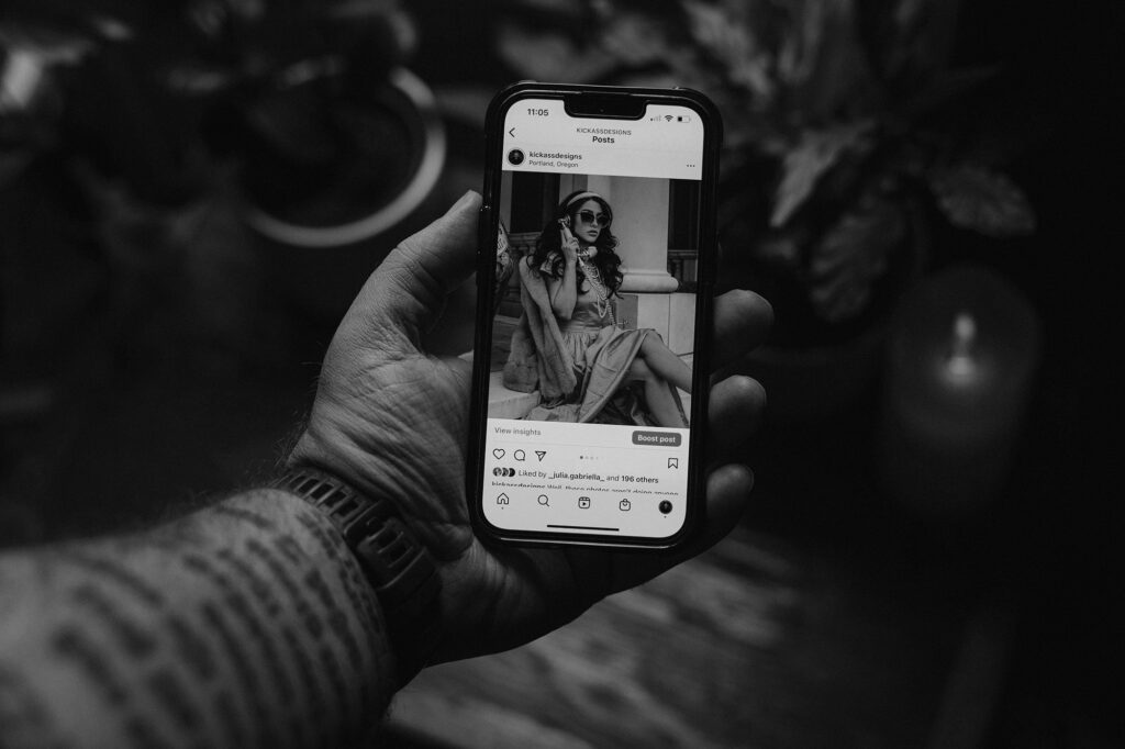 person holding a phone with instagram app open - The Best Portrait Photographers to Follow on Instagram