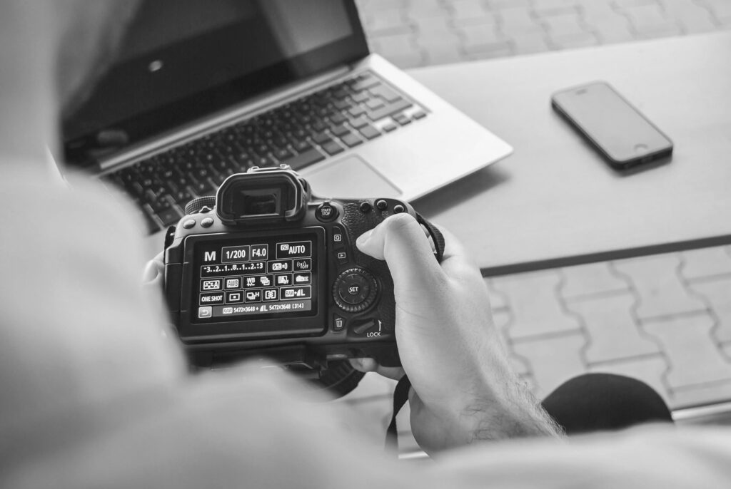 person checking out camera settings in the menu, including white balance