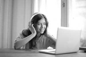 person with headphones on - learn why audio matters for your videos