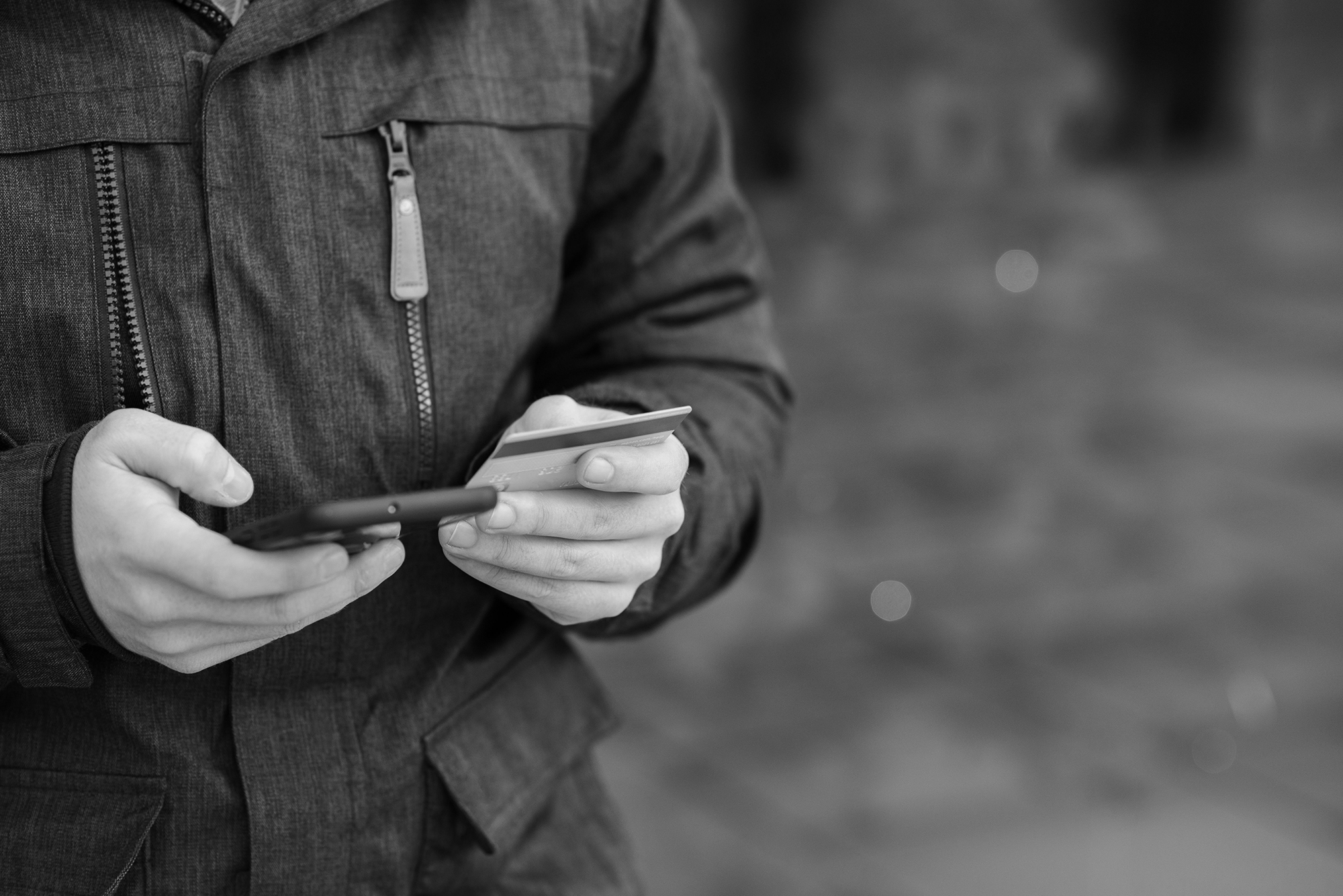 Why I've Become a Crypto-Friendly Freelancer - man holding a card and a phone
