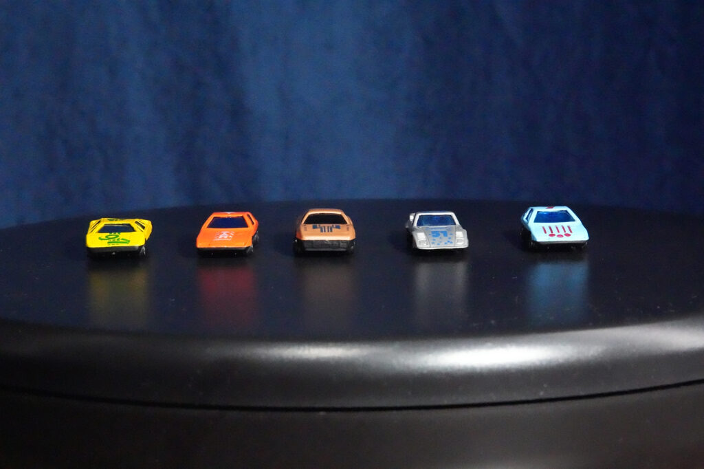 toy cars in a row: high iso and high noise