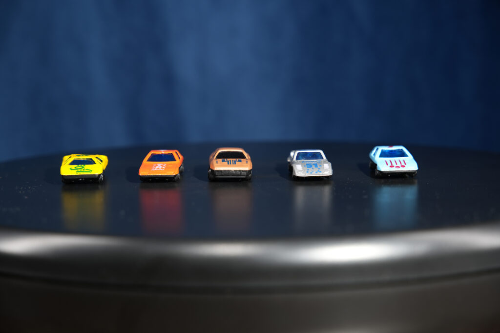 toy cars in a row: low iso and low noise