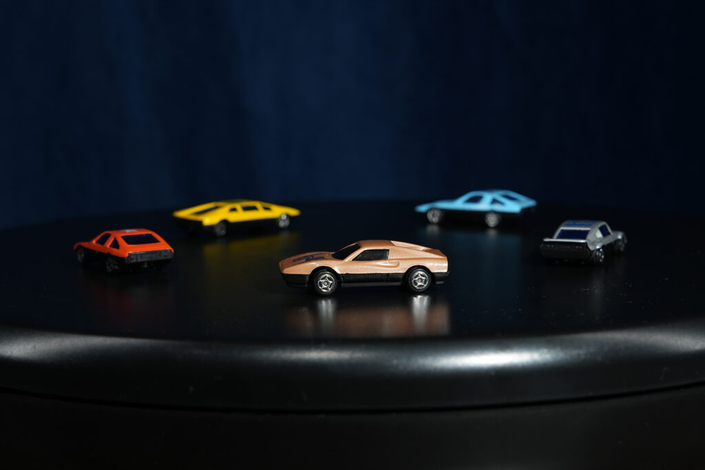 some toy cars on a lazy susan: moving subject with fast shutter speed