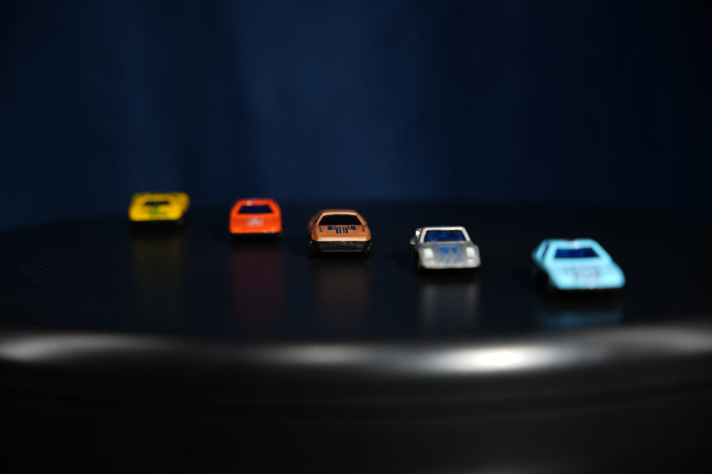 toy cars behind each other: open aperture and shallow depth of field